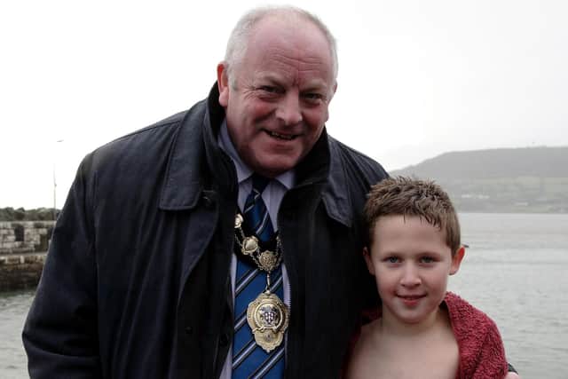 Ten-year-old Stuart Smyth, who is a pupil at Gracehill Primary School, is seen here being congratulated by Ballymena Mayor Ald Jim Alexander after completing the swim. BT1-124JC