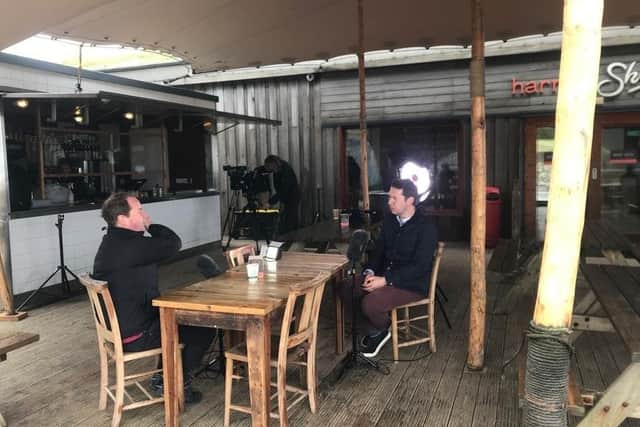 Paul Reilly interviewing Donal Doherty at Harry's Shack, Portstewart Strand.
