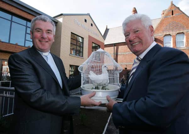 David McClay, (left) chairman of the Willowfield Parish Community Association with Comedian Roy Walker at the official opening of the Micah Centre, a new community facility at Willowfield Church, East Belfast in 2007. Picture: Brian Little/News Letter archives
