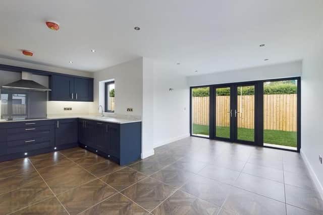 The property has a spacious open plan kitchen/dining with french doors to rear garden
