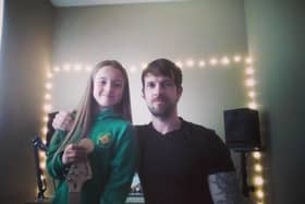 Larne singer-songwriter Martin Connon and his daughter Amber.