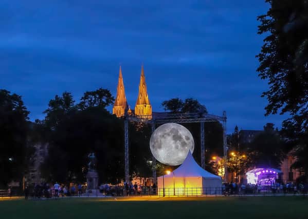 Crowds gather at dusk to view the Museum of the Moon the scale representation of the moon on The Mall, Armagh in July 2019.  Credit: www.LiamMcArdle.com
