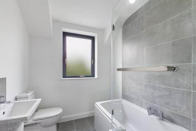 Bathroom with white three piece suite