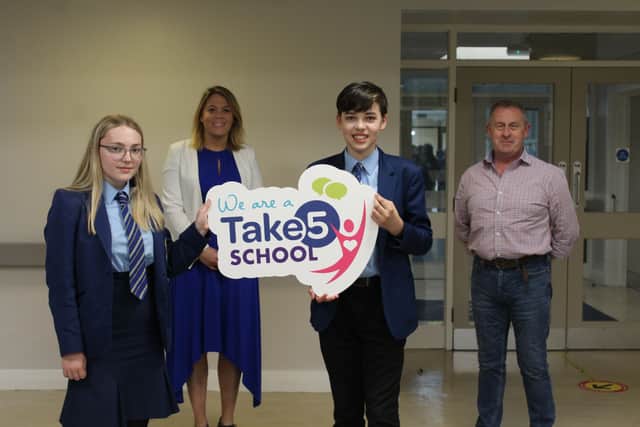 Mrs Frances Pepin, Vice Principal and pupils receive the Take Five Accredited Status award from Chris Lindsay of the Education Authority (NI)