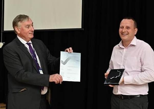 Ken Webb, Principal & Chief Executive, SERC presents Paul Mercer with his Silver Teaching Award for FE Lecturer of the Year