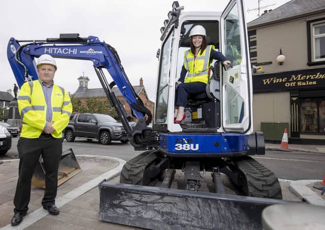 The Minister is pictured with Mickey Brady from Whitemountain Contractors as resurfacing work in Market Square, Dromore gets underway