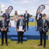 Cookstown High School pupils Ben Smyton, William Hamilton and John Mark McCrea receive their ABP Angus Youth Challenge finalist trophy alongside teacher Robyn Stewart. Also on the stage is George Mullan, ABP Managing Director, Martin McKendry, CAFRE College Director and Charles Smith, NI Angus Producer Group.