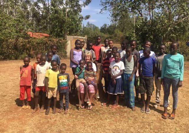 Mildred with the children in 2017 outside our third children's home