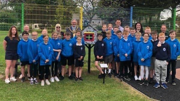 Pictured are the pupils from Olderfleet Primary School at the Little Free Library, at Curran Park Larne