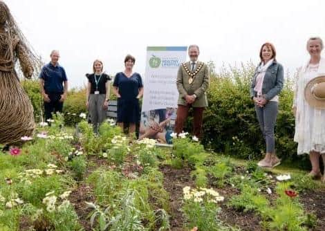 Mayor Cllr William McCaughey visits Islandmagee Community Garden one of the five projects in Mid and East Antrim which received NHLP funding