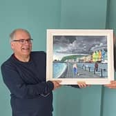 Presenting Rev Ian Carton with a painting of Whitehead seafront by artist Ken Stewart is Martin Clarke, acting chairman of Whitehead Community Association.