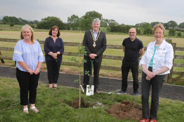 Fergal Barr from Causeway Coast and Glens Borough Council’s Community Development team and Joy Wisener from the Good Relations team, pictured with the Mayor of Causeway Coast and Glens Borough Council, Councillor Richard Holmes, Councillor Joan Baird, Councillor Margaret Anne McKillop, and Council staff at the tree planting event in Mosside