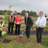 Colleen Connelly and John Lamont representing Mosside Independent Accordion Band and Lodge LOL No 25 pictured with the Mayor of Causeway Coast and Glens Borough Council, Councillor Richard Holmes, Councillor Joan Baird, Councillor Margaret Anne McKillop, and Council staff at the tree planting event in Mosside