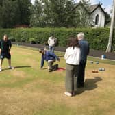 John Tan, pictured taking his shot, was new to bowling and now loves it.