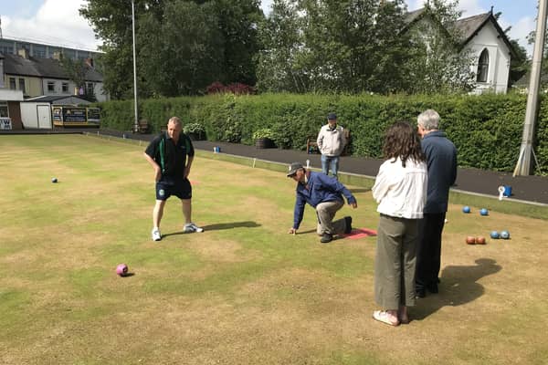 John Tan, pictured taking his shot, was new to bowling and now loves it.