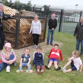 Mayor of Causeway Coast and Glens Borough Council, Richard Holmes, Maurice Bradley MLA, Councillor Russell Watton and Cassandra Hanna with local children at the Windyhall beacon
