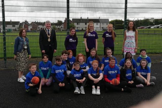 Melanie Rintoul, Senior Communities Officer at Radius Housing, Mayor CCGBC Richard Holmes, youth peer mentors, Cllr Stephanie Quigley and young people from Coleraine Summer Sports Weeks held at Coleraine West Community Centre