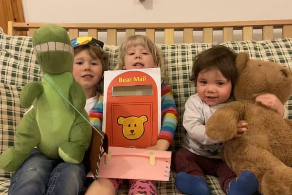 Joshua (5), Evelyn (3) and Benjamin (1) created their own portrait stamp and postcards as part of ‘From me to you- A journey of a postcard’, which saw children explore the journey of one little Bear’s postcard to his Granda Bear