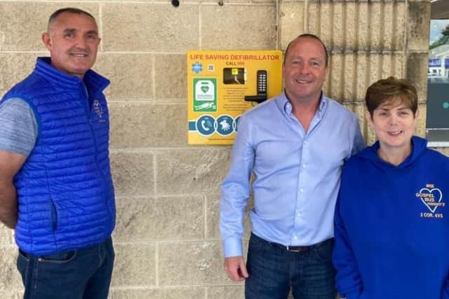 Ricky and Joyce Bell of The Gospel Bus Ministry pictured with Peter McCool (centre) at the handover of the defibrilator at McCool’s Centra store on the Antrim Road, Ballymena.