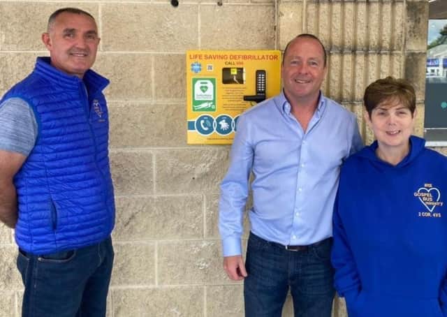 Ricky and Joyce Bell of The Gospel Bus Ministry pictured with Peter McCool (centre) at the handover of the defibrilator at McCool’s Centra store on the Antrim Road, Ballymena.