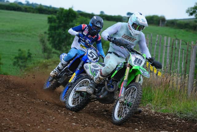 Jason Meara overall winner of the experts MX1 class and Richard Bird do battle in race two at Seaforde