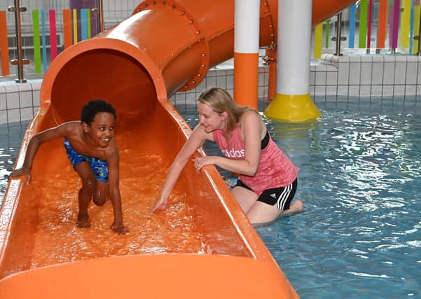 Councillor Sharon Skillen, Chair of the Leisure & Community Development Committee enjoys a splash with 7 year old Adugna at the Disability & Autism Friendly session at Lagan Valley LeisurePlex