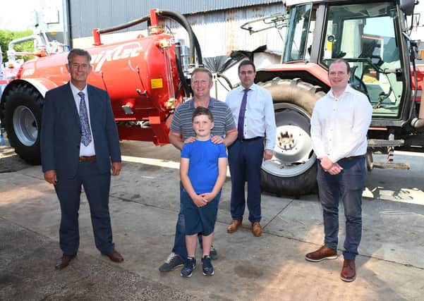 Agriculture Minister Edwin Poots and Economy Minister Gordon Lyons are pictured with Derek and Ben Robinson and CEO of the Health and Safety Executive Northern Ireland, Robert Kidd, to promote Farm Safety Week.