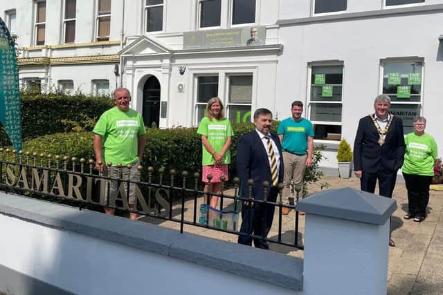 HHealth Minister Robin Swann and Mayor of Causeway Coast and Glens Borough Council Richard Holmes pictured with Samaritans listening volunteers (L-R) Robbie Glenn; Elaine Moore; Colin Taylor and Anne Kane