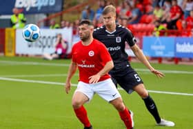 Larne’s David McDaid and Frederik Tingager of AGF Aarhus Mandatory Credit ©INPHO/Presseye/Philip Magowan