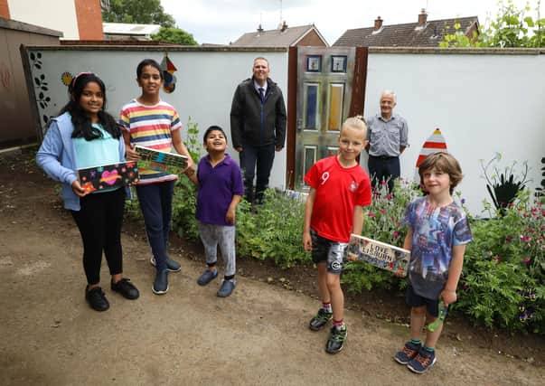 Chairman of the Council’s Environmental Services Committee, Councillor Andrew Ewing pictured with John Loughran and some of the children who did the artwork Kacper Graczew, James Abernathy, Felix Jose, Francis Jose, Freya Jose
