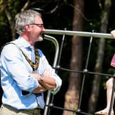 Mayor Cllr William McCaughey has a chat with a young play park user