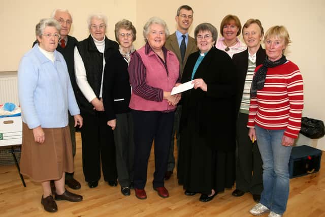 Dorothy Watson (Chairman Gracehill Country Markets) presents a cheque to Rev. Jan Mullan of Gracehill Morivan Church for the church building fund. BT47-267AC