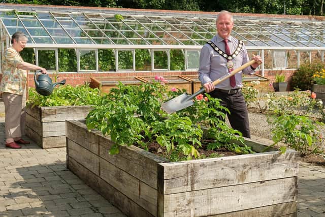 Chair of the Council, Councillor Paul McLean is pictured with Angela Lagan from St Mary’s Church Maghera, which was allocated a raised bed in the Walled Garden, Maghera.