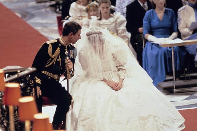 This is a  July 29 1981 file photo of  Prince  Charles  as he speaks with Princess of Wales during their wedding ceremony in St Paul's Cathedral n London. (AP Photo/File)