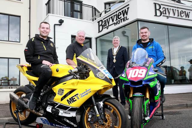 Road racers, Darryl Tweed and Neil Kernohan, pictured with Bill Kennedy, MBE, Clerk of Course and the Mayor of Causeway Coast and Glens Borough Council, Councillor Richard Holmes, during a visit to the Bayview Hotel in Portballintrae as part of the countdown to Armoy Road Races
