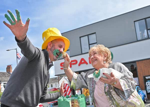 Olivia Nash celebrates SPAR’s fundraising smash for Marie Curie with Conor O’Kane from the charity, after shoppers and retailers across Northern Ireland smashed through their target, raising £97,000 during a morning of Blooming Great Birth-tea Parties in June. SPAR NI stores have now raised over £452,000 for Marie Curie since the partnership began.
