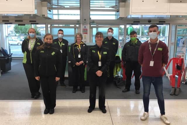 Asda Ballyclare staff members have been praised for helping customers during heavy rain.