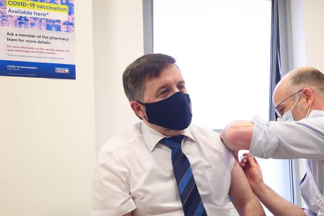 Health Minister Robin Swann receiving his vaccine at a community pharmacy in Ballymena.

He is pictured at the Ballee Pharmacy with pharmacist Stephen Burns. 

Picture: Kelvin Boyes / Press Eye.