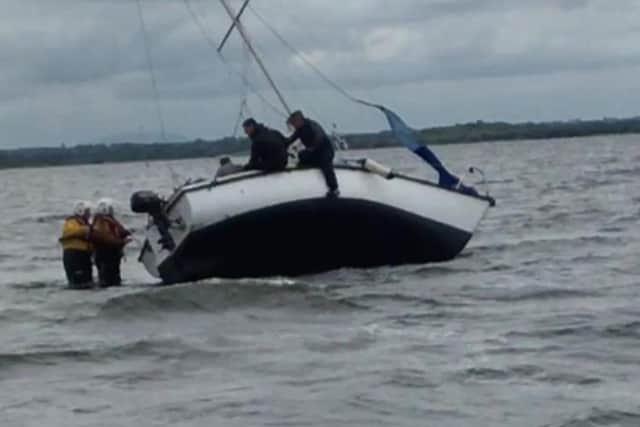 Lough Neagh Rescue tasked to save three people after sailing boat runs aground.