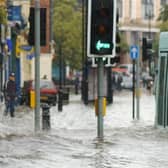 Flooding in Londonderry in 2004 - a bus negotiates its way along Strand Road which resembles a river.