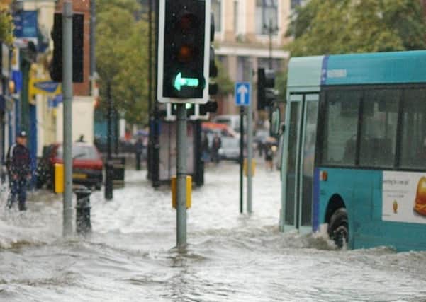 Flooding in Londonderry in 2004 - a bus negotiates its way along Strand Road which resembles a river.