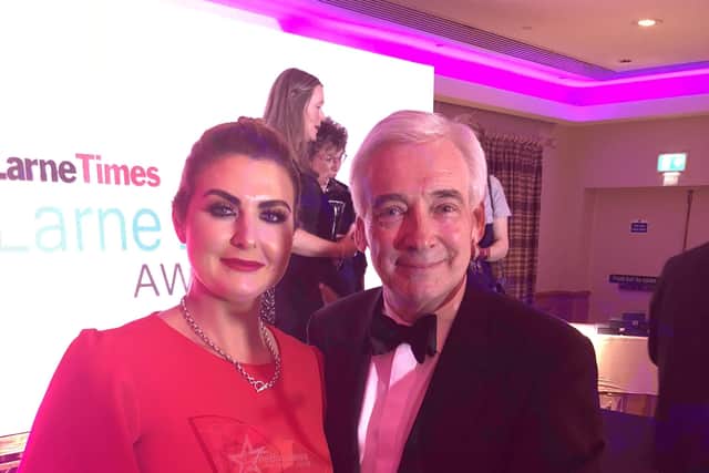Catrina Baxter of Perfections Beauty Clinic Ltd is congratulated on winning the Business Person of the Year category at the 2018 Larne Business Excellence Awards by compere Paul Clark.