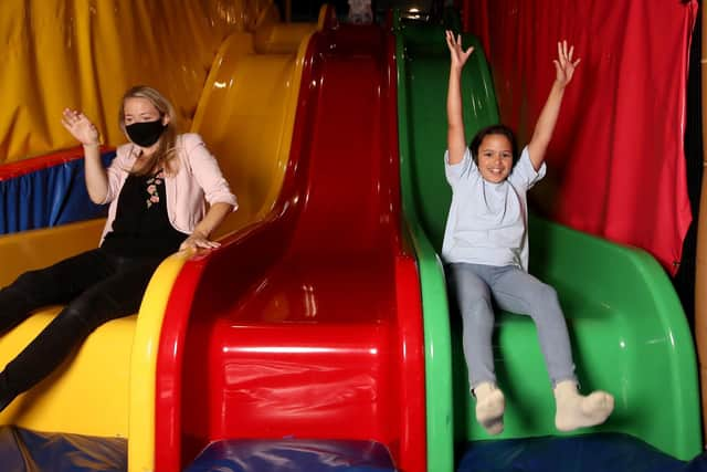 Cllr Skillen and Teddy on the slides