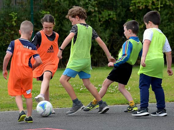 Soccer action from the recent kids sports camp at Broadbridge Primary School. DER2130GS - 054 (Picture by George Sweeney)