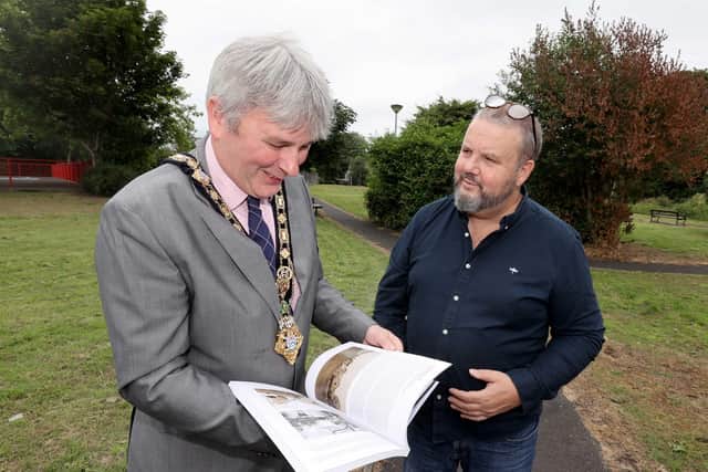 The Mayor of Causeway Coast and Glens Borough Council Councillor Richard Holmes looks through a copy of Dervock & District Community Association’s recently produced book ‘The Parish of Derrykeighan – A Rammel Through North Antrim: The Who, The What, The Where’ made possible by Causeway Coast and Glens Borough Council’s £3.8m Local Area Action Plan, funded by the European Union’s PEACE IV Programme, managed by the Special EU Programmes Body (SEUPB)