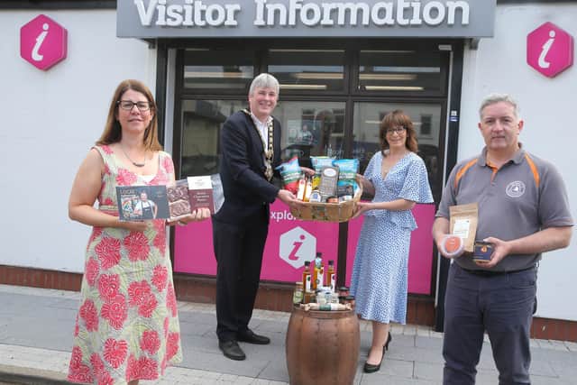 Caroline Carey, Causeway Coast and Glens Borough Council's Visitor Servicing Officer, the Mayor of Causeway Coast and Glens Borough Council Councillor Richard Holmes, Stella Bolton, Taste Causeway CIC Board Member, and Eoin McConnell from Naturally North Coast and Glens Artisan Market