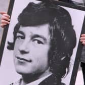 Hunger striker Thomas McElwee's image being carried in a parade.