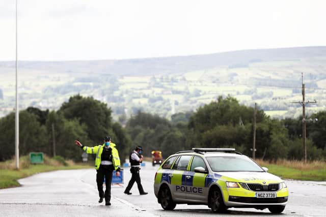 Press Eye - Belfast - Northern Ireland -   Monday 9th August  August 2021   Photo by Jonathan Porter /   Press Eye   Police at the scene after a man died in a crash on the Glenshane Pass following a two-vehicle road traffic collision on Glenshane Road, between Dungiven and Maghera this morning.