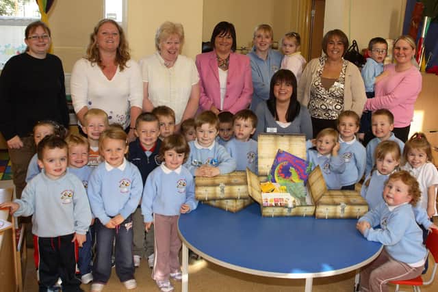 NEELB Children’s Services Manger Kim Aiken, Eary Years Support Worker Eileen Russell, NEELB staff member Anne Connolly and Harryville Primary School principal Mrs Meakle are seen here with pupils from the school’s nursery section at last week’s launch of the “My Treasure Chest” scheme. Included are Harryville P.S. nursery staff members Miss Ritchie, Mrs McKenna and Miss Crawford. BT42-100JC