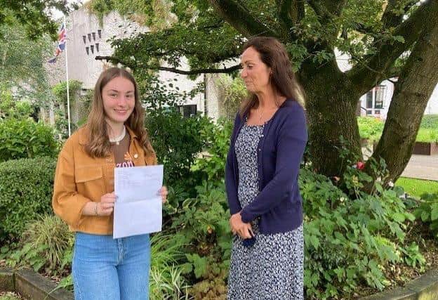 Amy McGookin former Head Girl celebrates with Dr Rainey on achieving an A star grade and 2 A grades at A level.